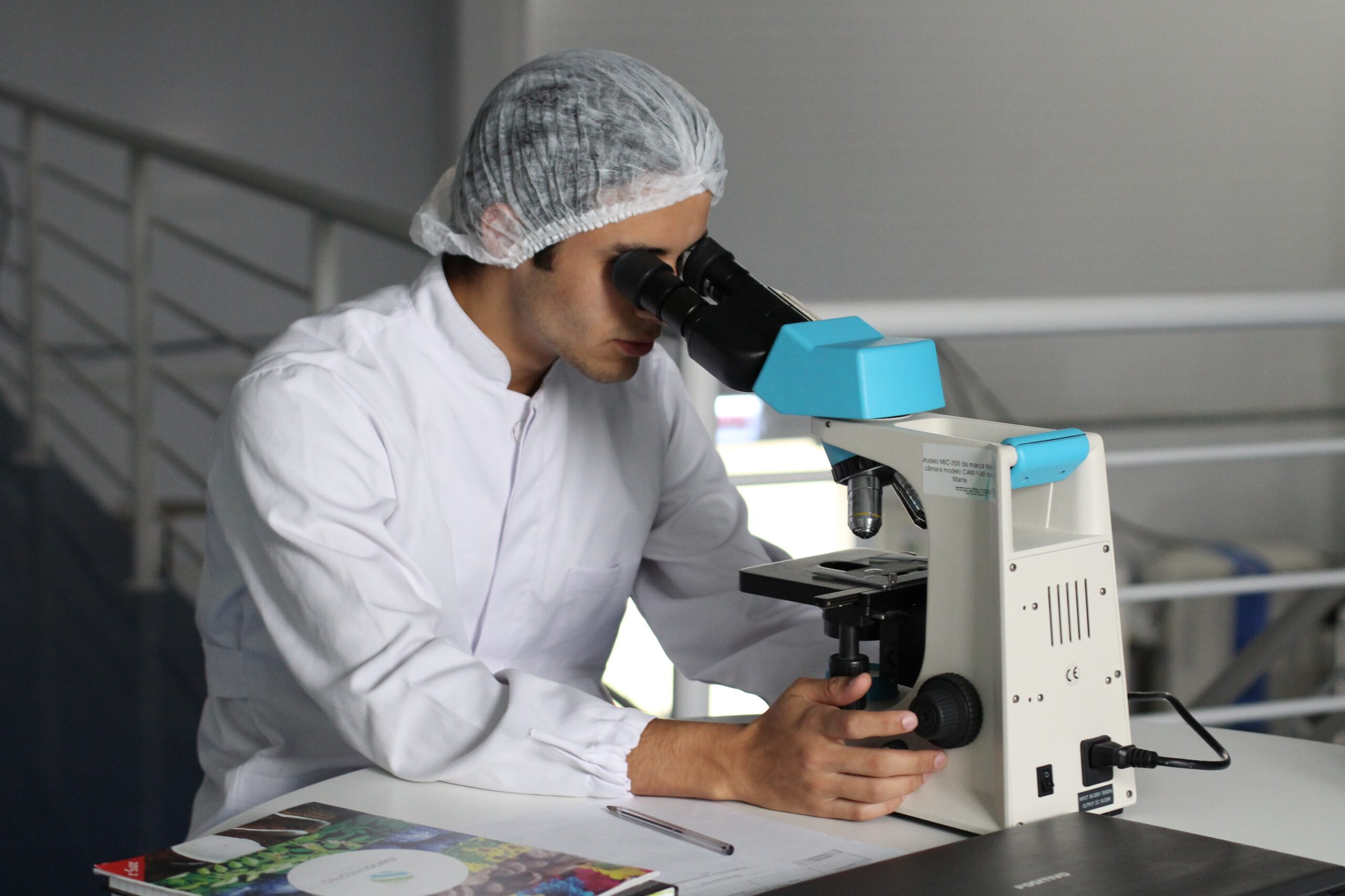 Scientist looking at something through a microscope