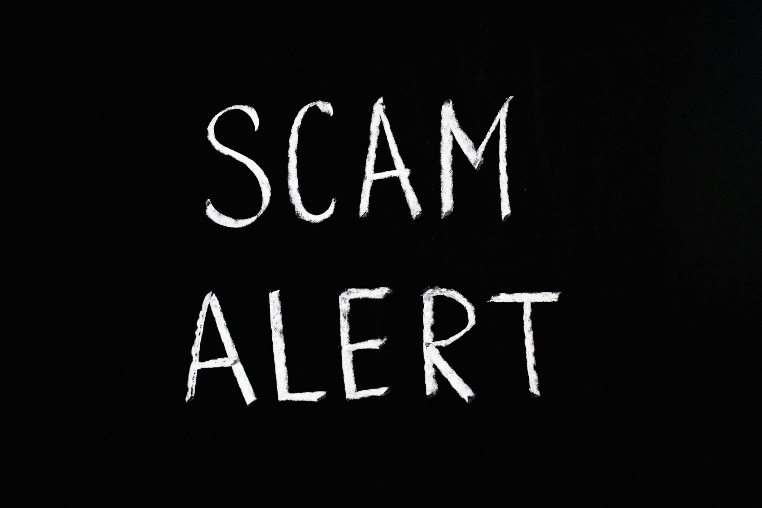 The words "SCAM ALERT" on a black background